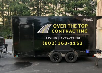 Over the Top branded black trailer