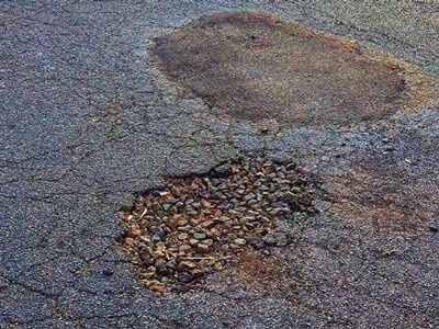 Patching holes in asphalt